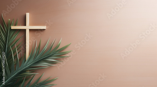 White cross gracefully placed beside a palm leaf on a soft brown background, echoing the spirit of Palm Sunday.