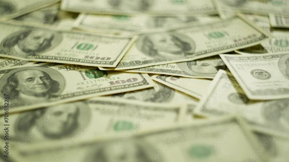 Background video on which the American national currency is laid out. A large amount of money in denominations of 100 dollars. High quality 4k footage Background video on which the American national currency is laid out. A large amount of money in denominations of 100 dollars. High quality 4k footage