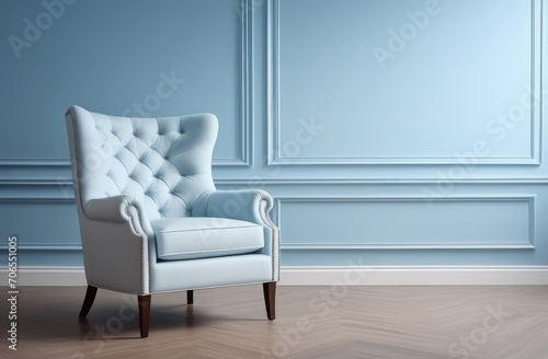 Blue-walled cozy classic-style space with stucco  molding  comfortable armchair. Interior design.