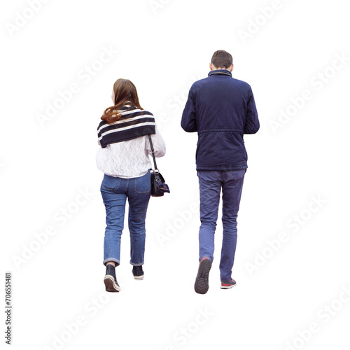 Couple de personnes photographiés de dos qui marche, l'homme regarde son téléphone portable et la fille regarde vers la droite, ils sont habitués chaudement.  photo