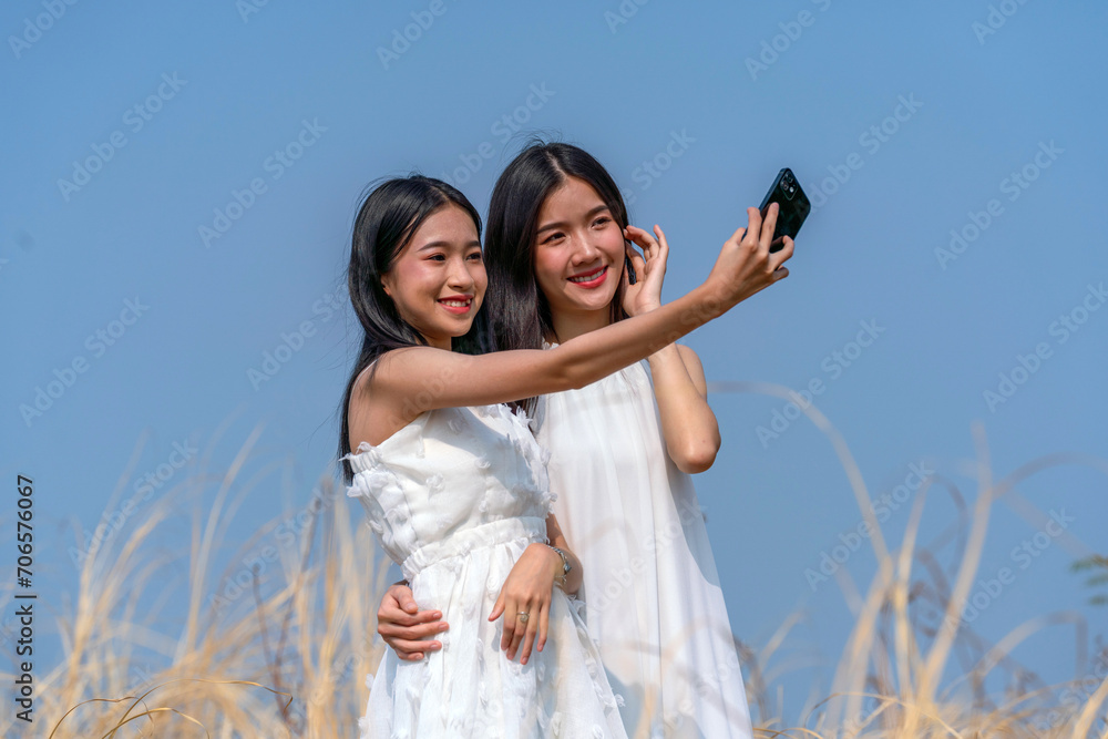 Young asian women selfie outdoor against blue sky Young asian women selfie outdoor against blue sky