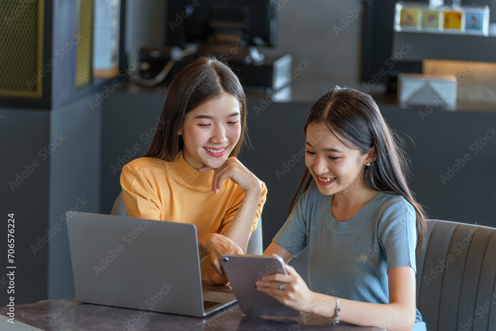 Weekend Out-of-Office Collaboration. Two young Asian woman break away from the office, opting for a cozy café to discuss work. Weekend Out-of-Office Collaboration. Two young Asian woman break away from the office, opting for a cozy café to discuss work.