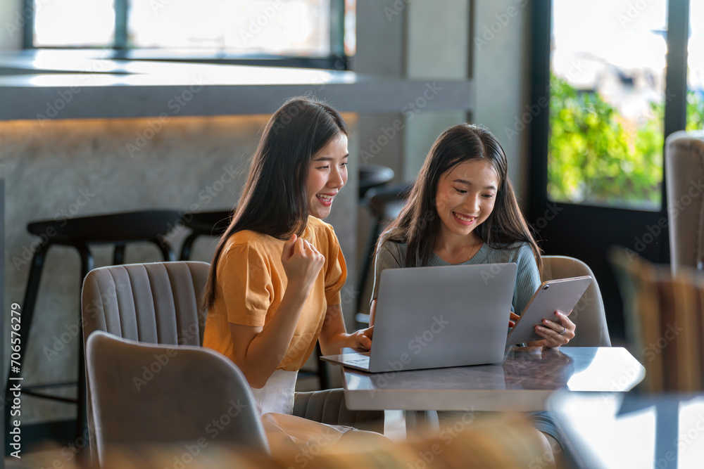 Weekend Out-of-Office Collaboration. Two young Asian woman break away from the office, opting for a cozy café to discuss work. Weekend Out-of-Office Collaboration. Two young Asian woman break away from the office, opting for a cozy café to discuss work.