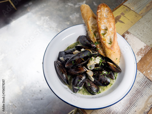 Black mussels sautéed with evoo, garlic, butter marinara sauce serve and baguette.