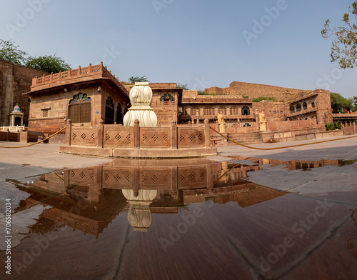 Reflection of a White fountain in the historical golden palace at Rajasthan India photo