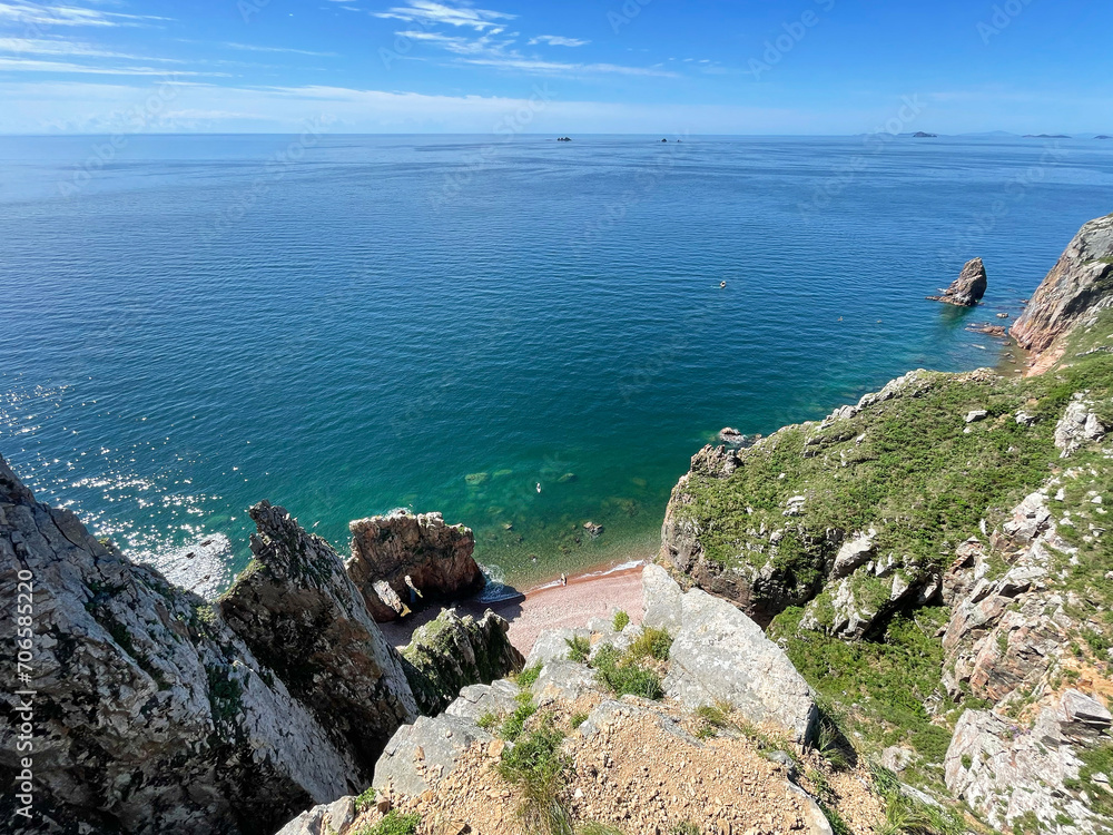 The beautiful Southeastern coast of the island of Shkota in August in sunny weather. Russia, Vladivostok city
