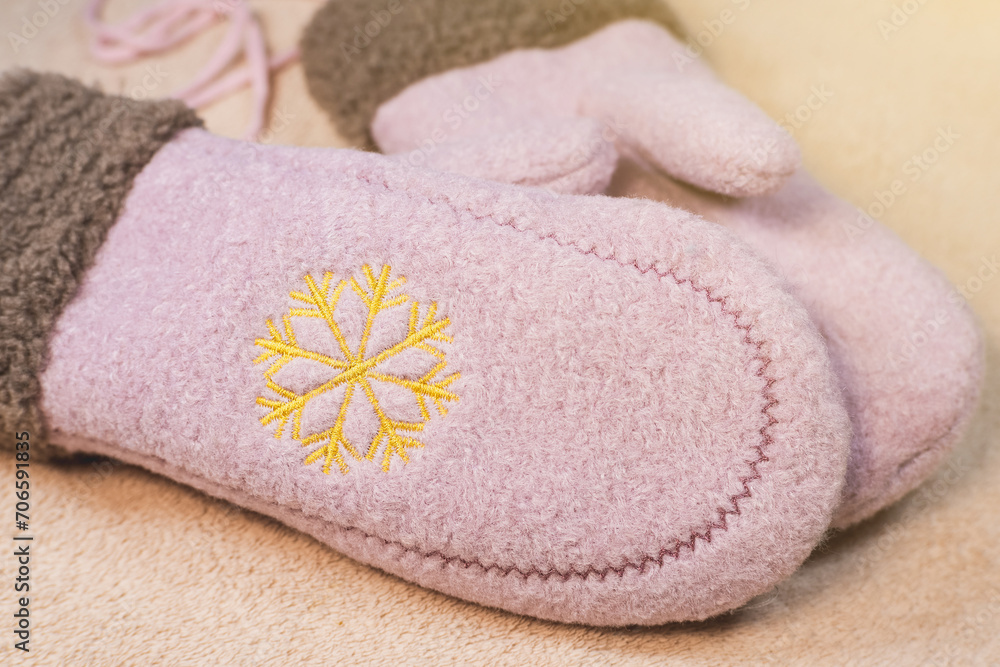 Cute pink mittens. Beautiful modern Clothes for cold weather wearing. Romantic Present for girl on Saint Valentine day. Cute pink mittens. Beautiful modern Clothes for cold weather wearing. Romantic Present for girl on Saint Valentine day.