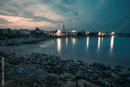 Colorful cloudy sunset of the port city with colorful light reflection on the sea water at Kanyakumari tamilnadu India