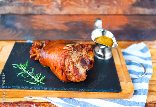 Roasted pork leg (rulka) served with garlic sauce photo