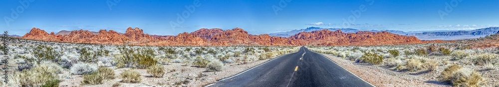 Panoramic picture of a lonely road through mountainous desert Panoramic picture of a lonely road through mountainous desert