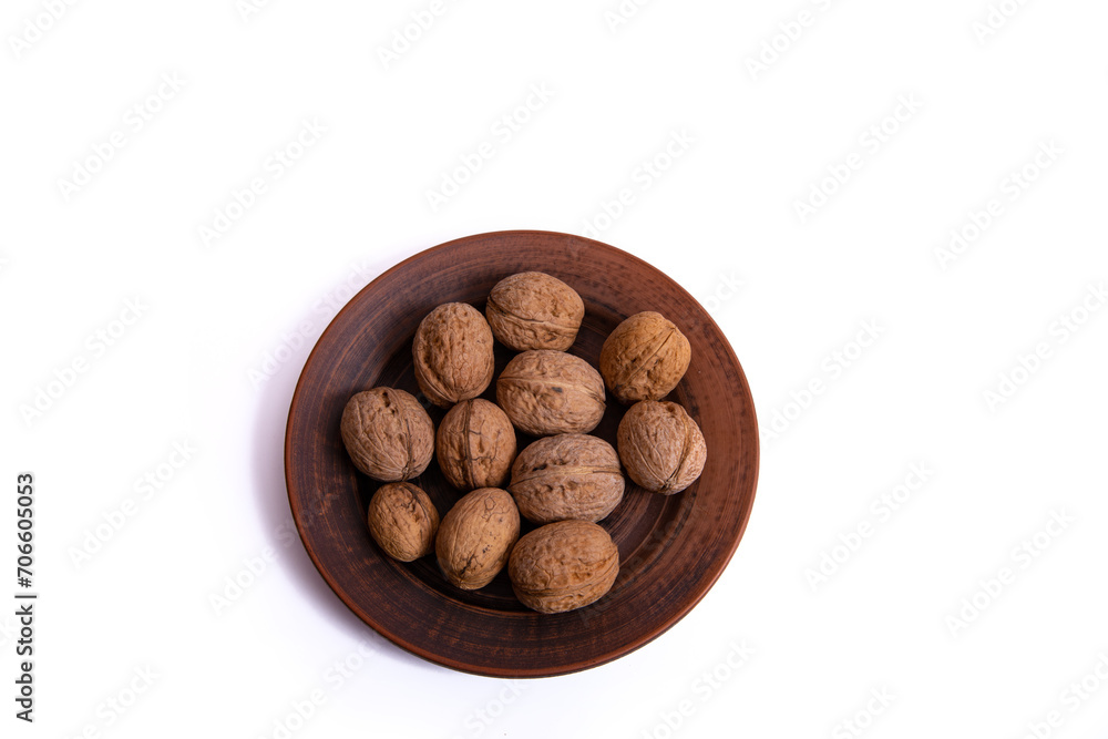 Walnuts are on a plate. Isolate. Ingredients. Diet and weight loss. Vitamins.