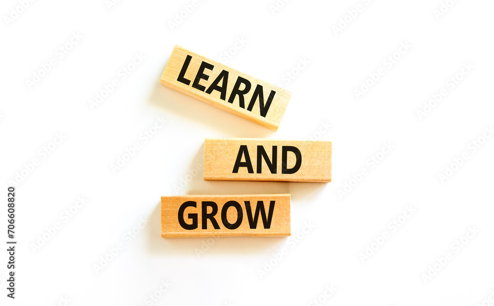 Learn and grow symbol. Concept word Learn And Grow on beautiful wooden block. Beautiful white table white background. Business, education learn and grow concept. Copy space. Learn and grow symbol. Concept word Learn And Grow on beautiful wooden block. Beautiful white table white background. Business, education learn and grow concept. Copy space.