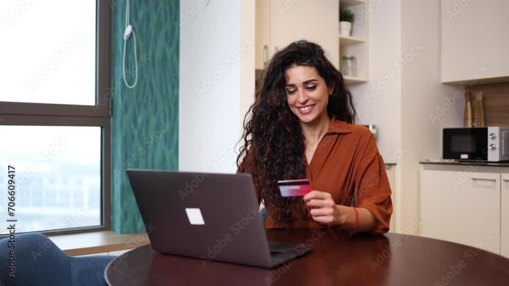 Happy woman using her credit card for online shopping Happy woman using her credit card for online shopping