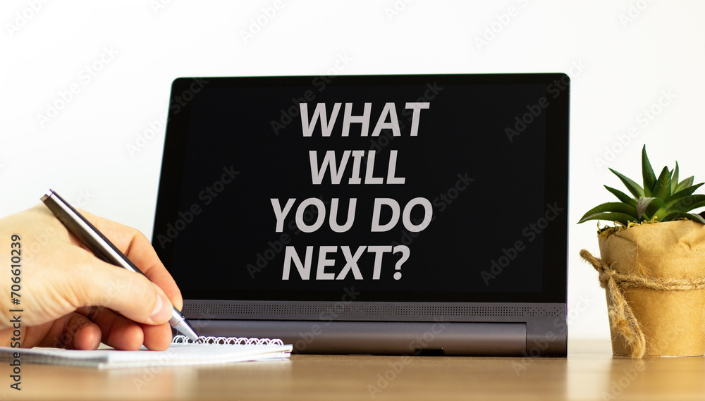 What will you do next symbol. Concept words What will you do next on beautiful black tablet. Beautiful white background. Businessman hand. Business, what will you do next concept. Copy space. What will you do next symbol. Concept words What will you do next on beautiful black tablet. Beautiful white background. Businessman hand. Business, what will you do next concept. Copy space.