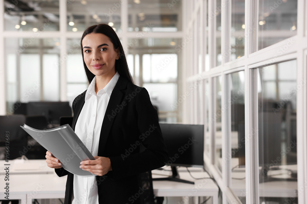 Beautiful woman with folder in office, space for text. Lawyer, businesswoman, accountant or manager Beautiful woman with folder in office, space for text. Lawyer, businesswoman, accountant or manager