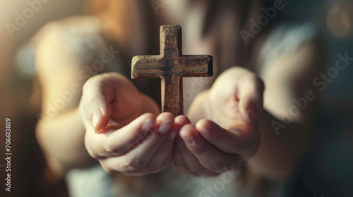 Pair of hands clasped around a wooden cross, conveying a sense of faith, prayer, and spirituality