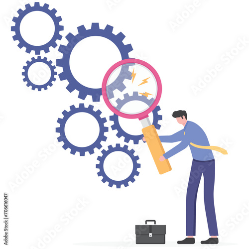 Analyze and find business flaws. Businessman using a magnifying glass to look at the gears

