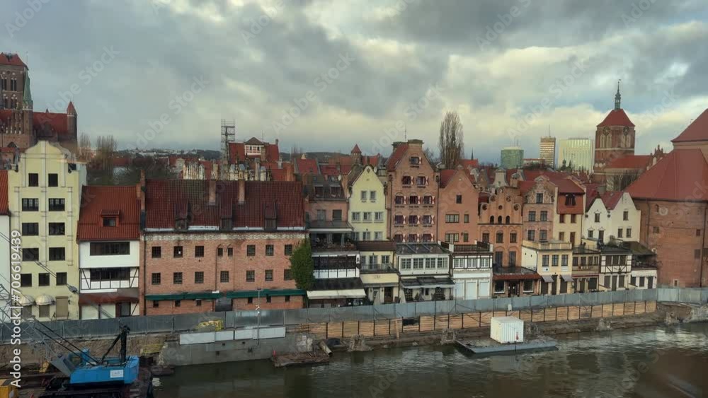 Panorama. City old town. View of the rudder of the port city and the water canal from the window. Gdańsk, Poland Panorama. City old town. View of the rudder of the port city and the water canal from the window. Gdańsk, Poland