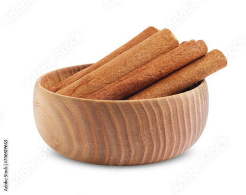 Aromatic cinnamon sticks in bowl isolated on white