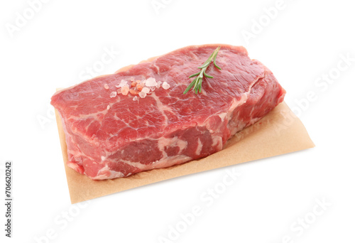 Steak of raw beef meat and spices isolated on white