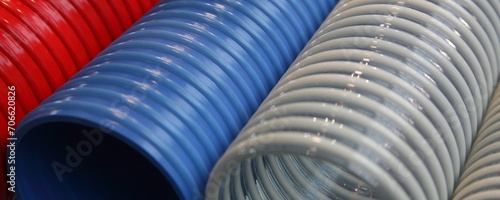 Modern colored polymer spiral pipes closeup photo