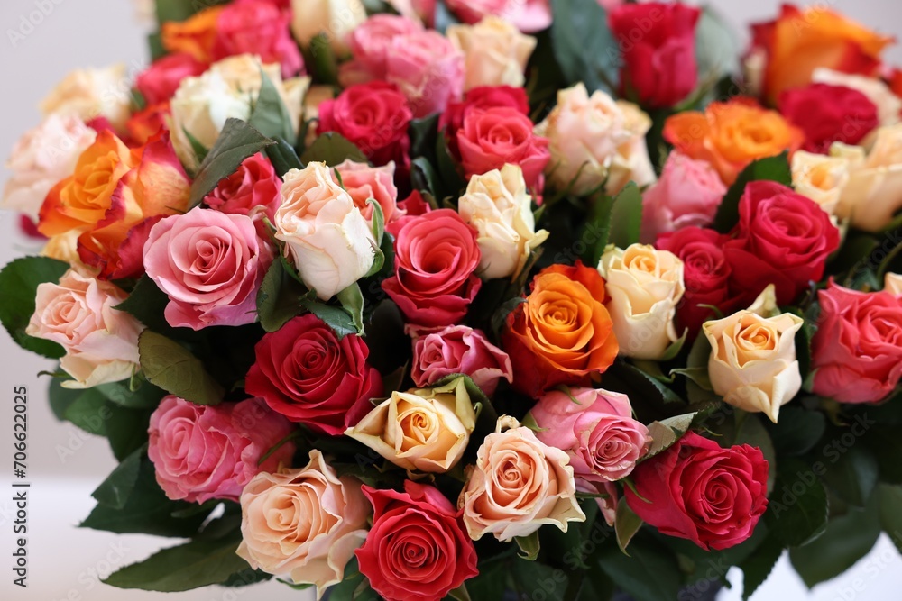 Bouquet of beautiful roses on light grey background, closeup Bouquet of beautiful roses on light grey background, closeup
