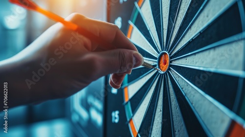 businessman hand touching to target dart board for setup and achievement objectives target for business investment concept.    photo