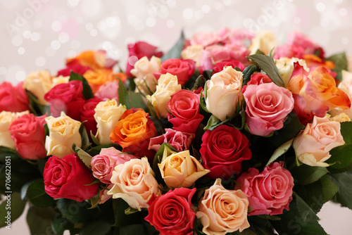 Bouquet of beautiful roses on light background  closeup