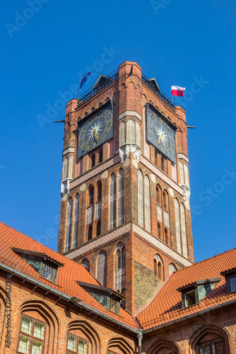 Clock tower of the historic town hall building in Torun, Poland