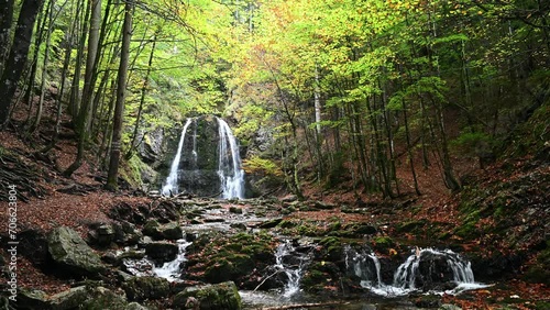 Autumn ambience at a waterfall in a forest