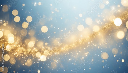 abstract christmas bokeh lights with gold sparkles on blue background