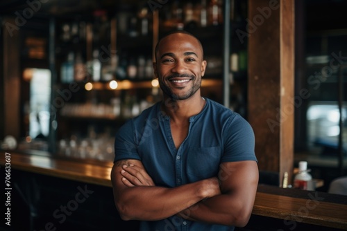 Portrait of a smiling young man at the bar