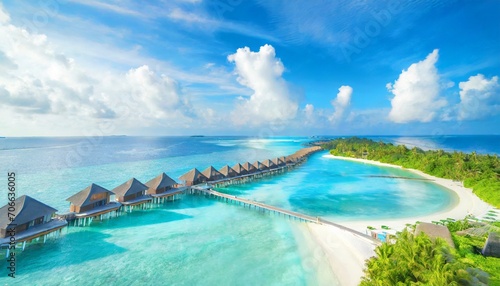 perfect aerial landscape luxury tropical resort or hotel with water villas and beautiful beach scenery amazing bird eyes view in maldives landscape seascape aerial view over a maldives © Irene