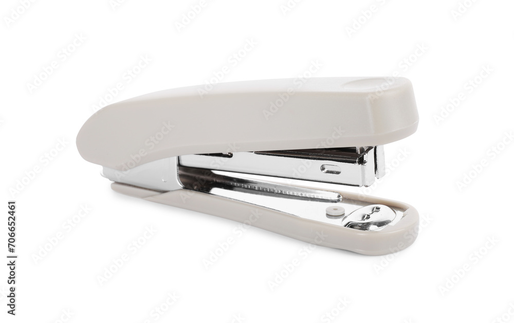 One new beige stapler isolated on white One new beige stapler isolated on white