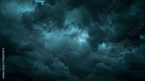 Black dark greenish blue dramatic night sky. Gloomy ominous storm rain clouds background. Cloudy thunderstorm hurricane wind lightning. Epic fantasy mystic. Or creepy spooky nightmare horror concept. photo