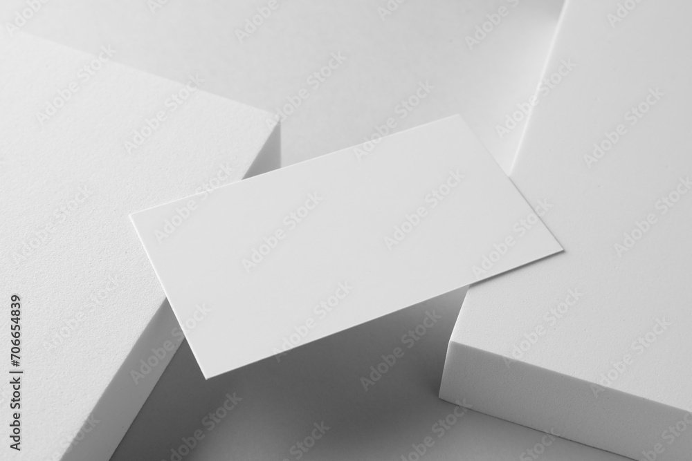 Empty business card and decorative elements on white background. Mockup for design Empty business card and decorative elements on white background. Mockup for design
