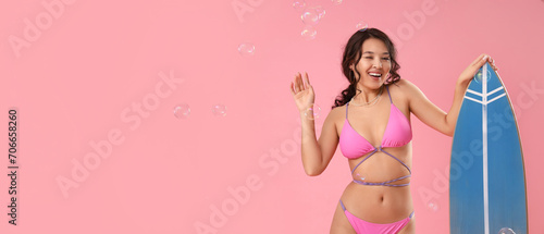 Happy young woman in swimsu...