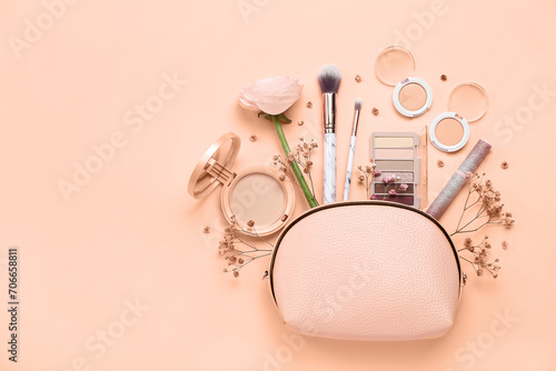 Composition with bag, makeup cosmetics and flowers on nude background. Banner for design photo