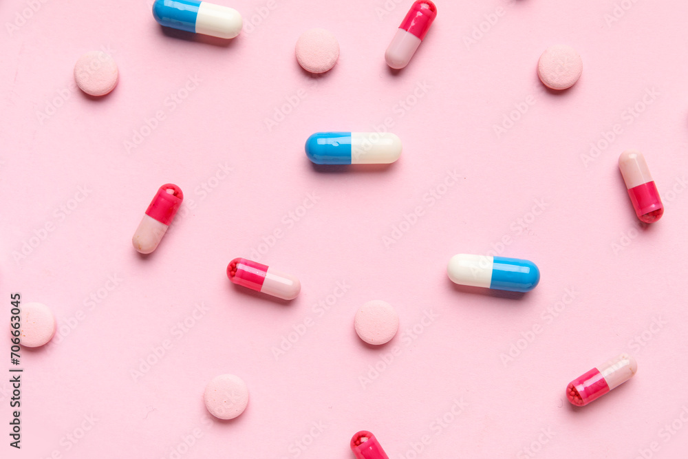 Different pills on pink background Different pills on pink background