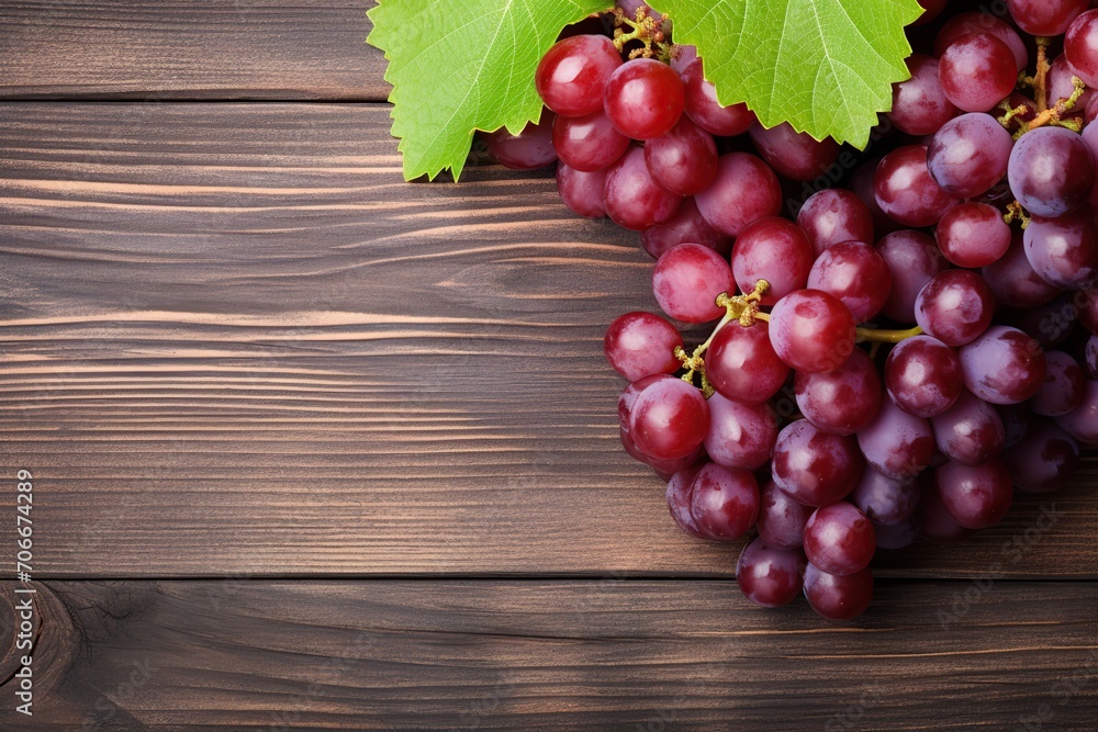 Ripe red grape on wooden background Ripe red grape on wooden background