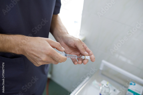 close up of a doctor injecting a vaccine
