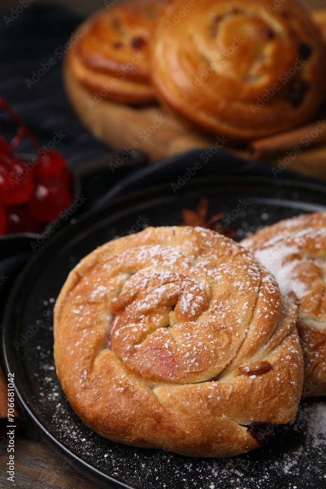 Delicious rolls with sugar powder on table, closeup. Sweet buns Delicious rolls with sugar powder on table, closeup. Sweet buns