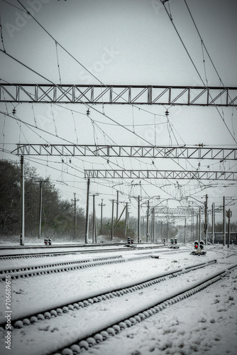 Street photography at winter . Snowy weather . Buildings in small town in Ukrain . Snow in the railway station. 