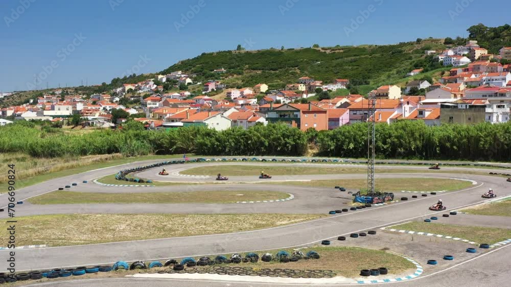 Aerial top down view of racing car kart driving on winding race track ...