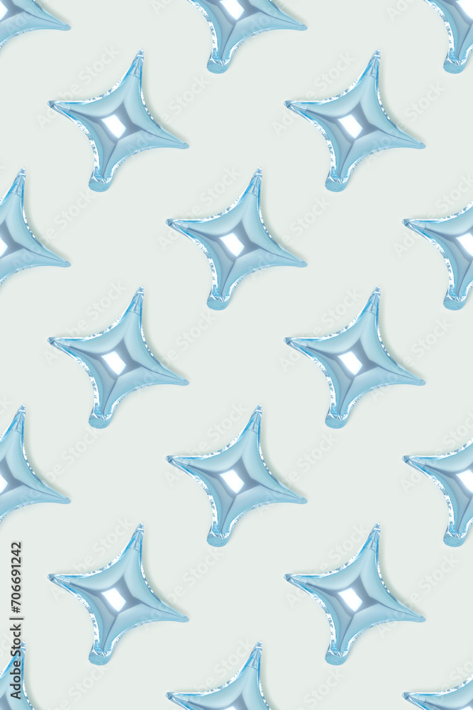 Obraz premium Repetitive pattern made of air star balloons on a blue background. Monochrome backdrop.