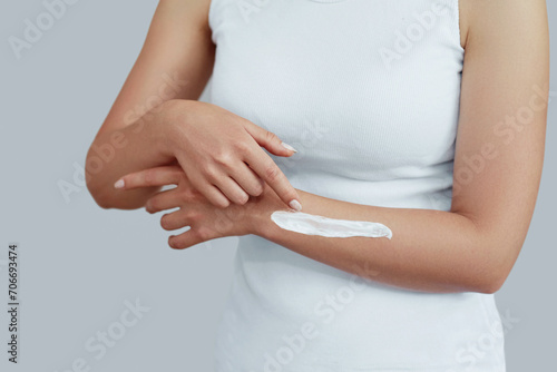 Wallpaper Mural Closeup shot of woman hands holding cream and applying moisturizing hand cream. Beautiful female hands with cream. Hand Skin Care. A woman uses body lotion on your arms. Beauty And Body Care Concept Torontodigital.ca