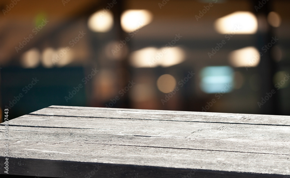 Empty dark wooden table in front of restaurant abstract blurred bokeh background. can be used to demonstrate or mount your products. Layout for space Empty dark wooden table in front of restaurant abstract blurred bokeh background. can be used to demonstrate or mount your products. Layout for space