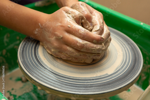 Clay, pottery or hands in designer workshop working on an artistic cup or mug mold in small business studio. Hand of creative artist or worker manufacturing handicraft products in sculpture