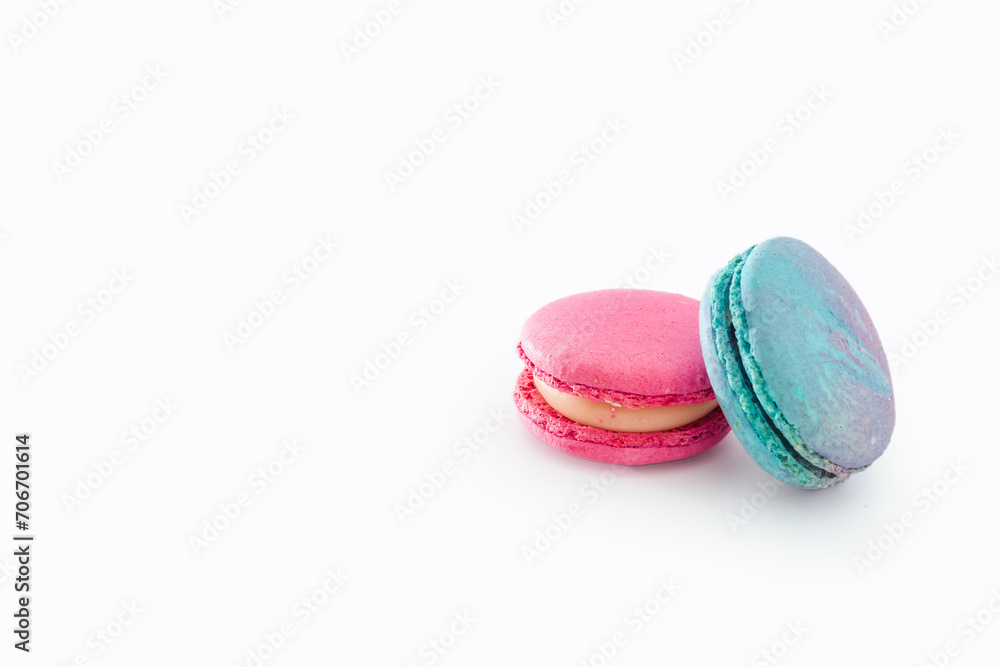 Tasty colorful macarons isolated on white background. Sweet macaroons dessert. Two multi-colored blue and pink macaroons. French pastry, almond cookies from egg whites. Tasty colorful macarons isolated on white background. Sweet macaroons dessert. Two multi-colored blue and pink macaroons. French pastry, almond cookies from egg whites.