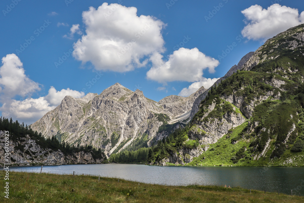 Sunny Rocky Peak with Tappenkarsee in Austria. Mountain Landscape in Kleinarl. Picturesque Nature in European Summer. Sunny Rocky Peak with Tappenkarsee in Austria. Mountain Landscape in Kleinarl. Picturesque Nature in European Summer.
